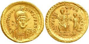  Theodosius II, AD 402-450. Gold Solidus (4.45 g) minted at Constantinople, AD 425-429. Helmeted and cuirassed bust facing of Theodosius II holding shield decorated with horseman. Reverse: Theodo ...